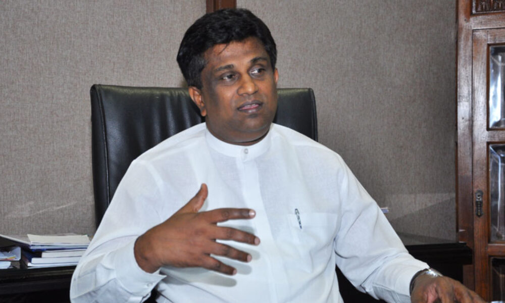 “එදා ඇඳන් යට හිටපු අය අද වීරයෝ වෙලා” – හර්ෂණගෙන් අජිත් පී. පෙරේරාට සැර පිළිතුරක්