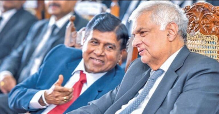 පුතා කෝටි 12ක කප්පම් නඩුවට හිරේ යද්දී, පොහොට්ටුවෙන් පත් වූ රනිල් හදිසියේම විජේදාසගේ නිවසට යයි